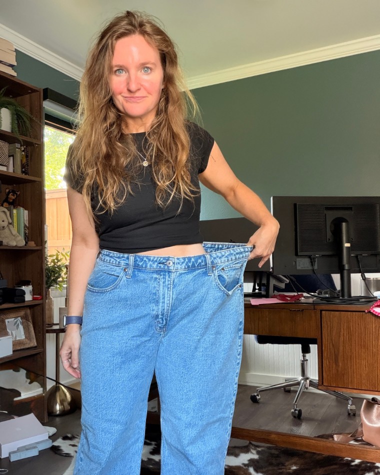 Sula shows off her slimmer figure in old jeans. "I knew that I needed to make a change," she says.
